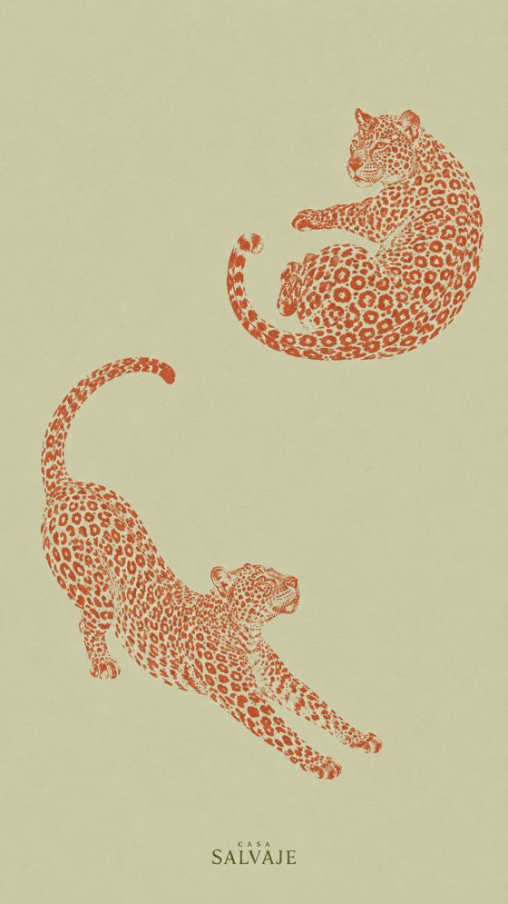 Dos jaguares naranjas sobre verde